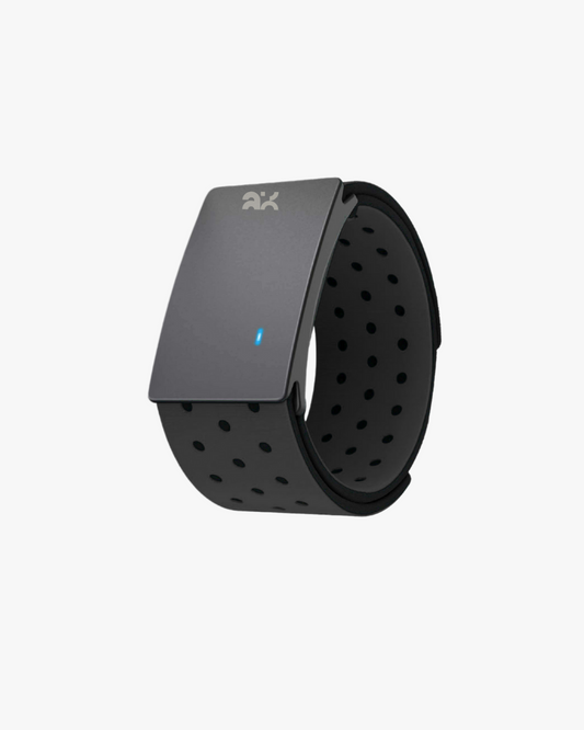 Black fitness tracker with a perforated band on a white background