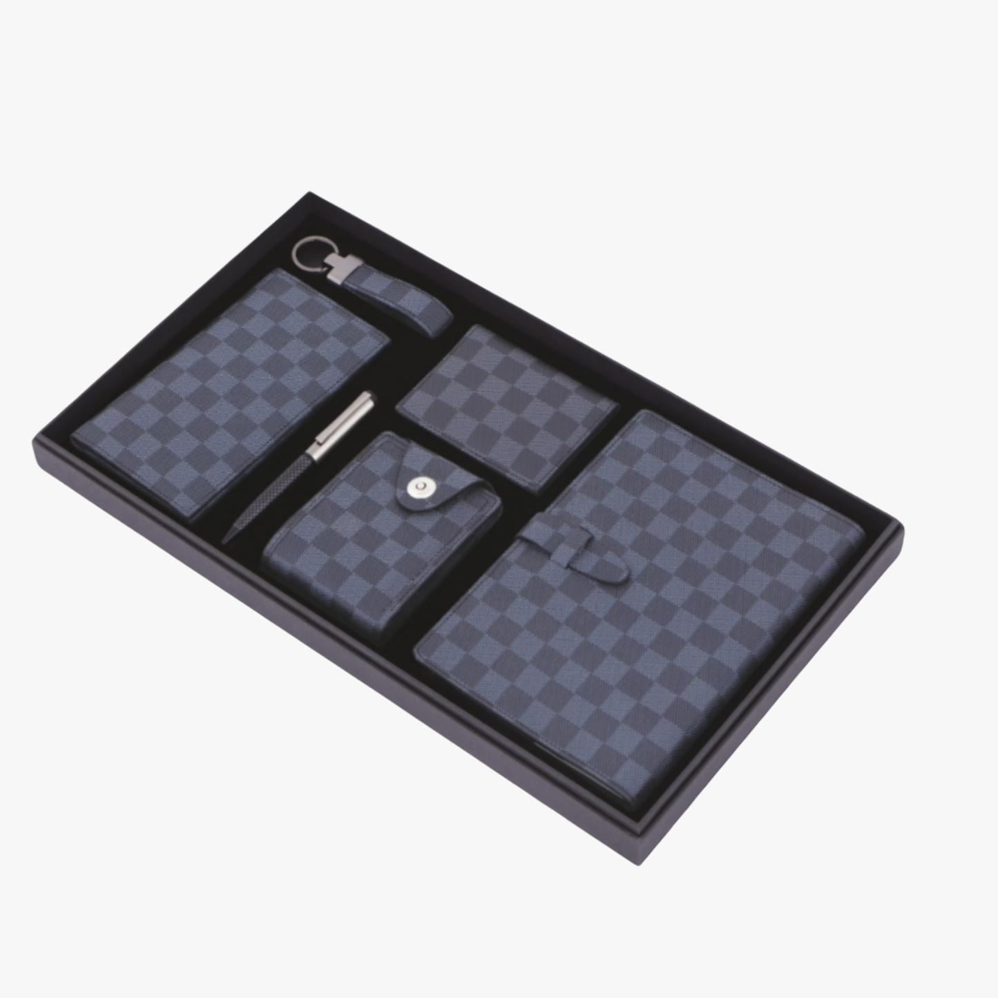 Set of checkered pouches and a pen in a black tray on a white background