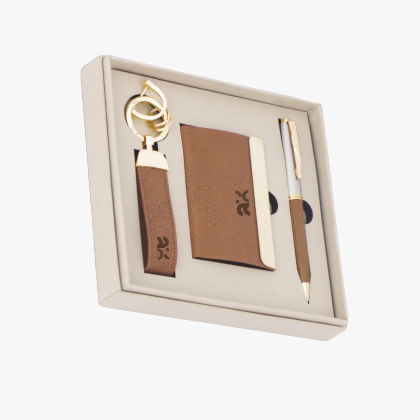Set of keychain, cardholder, and pen in a box on a white background