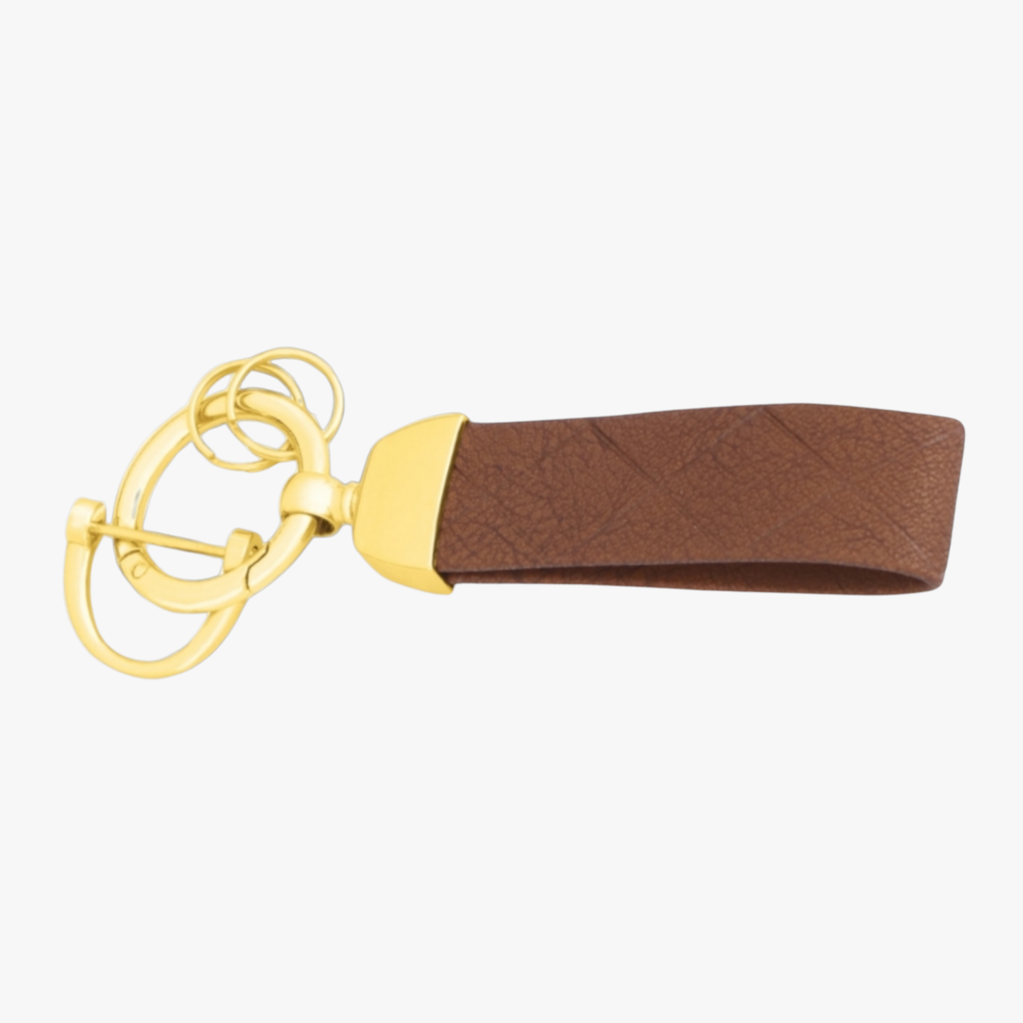 Gold keychain with a brown leather strap on a white background