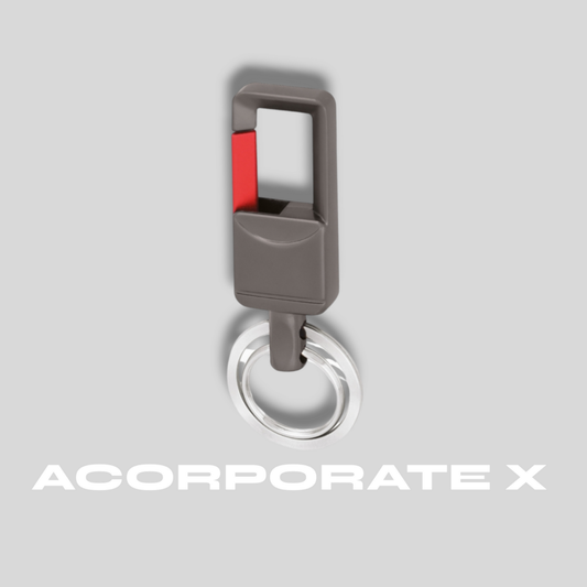 Keychain with a red accent on a gray background, featuring the brand 'ACorporate X'.