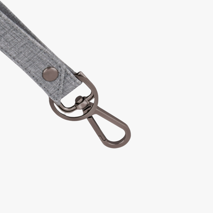 Gray fabric keychain with metal clip on a white background