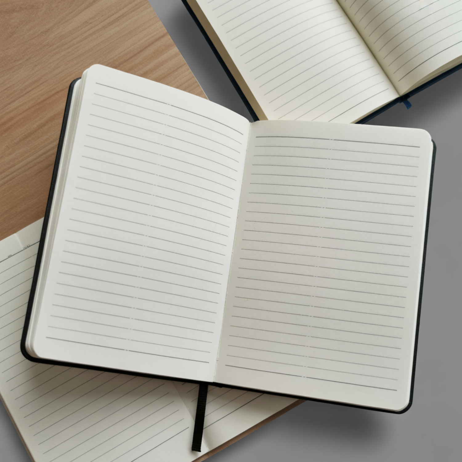 Open notebook with lined pages on a wooden surface